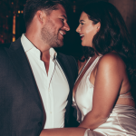 a curvy woman and a man in a bar